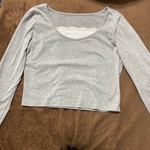 Grey long sleeve shirt with attacked white under lacing at the top, size small